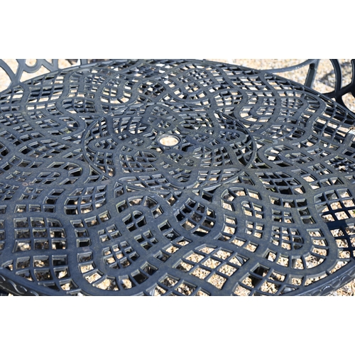 40 - A cast alloy circular garden table with four chairs 124 cm diam (5)