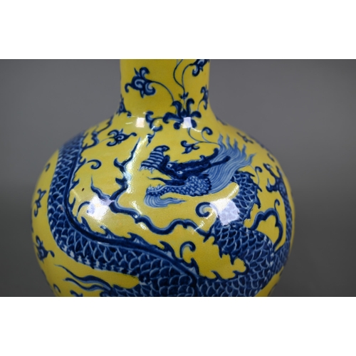 402 - A Chinese doucai vase with Qianlong mark, 31 cm high to/w a blue and yellow 'dragon' vase with Xuand... 