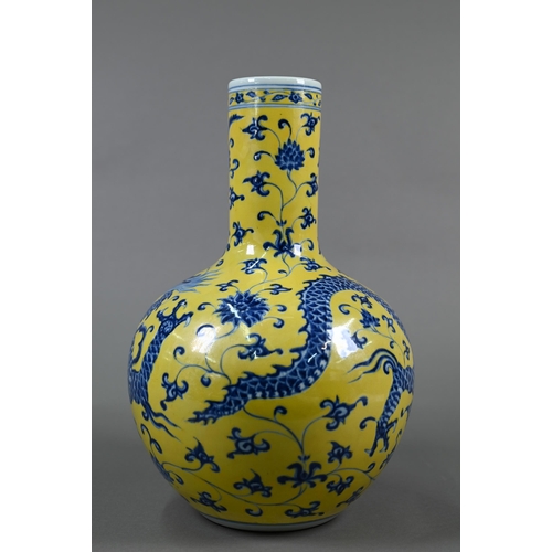 402 - A Chinese doucai vase with Qianlong mark, 31 cm high to/w a blue and yellow 'dragon' vase with Xuand... 