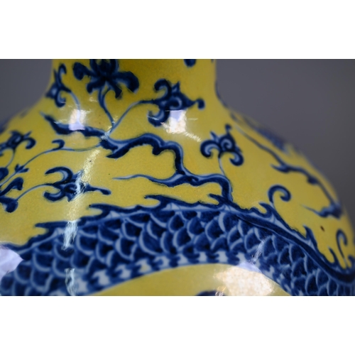 402 - A Chinese doucai vase with Qianlong mark, 31 cm high to/w a blue and yellow 'dragon' vase with Xuand... 