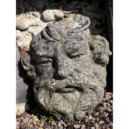 41 - A composite stone 'Green man' water spout plaque to/w a similar wall pocket planter (2)