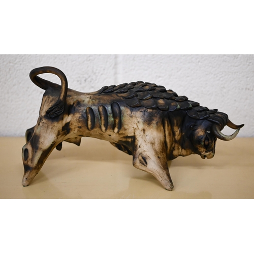 455 - André Lovet (Sidmouth, Devon) - a stoneware bull, signed, no 108, 36 cm long to/w an unmarked studio... 