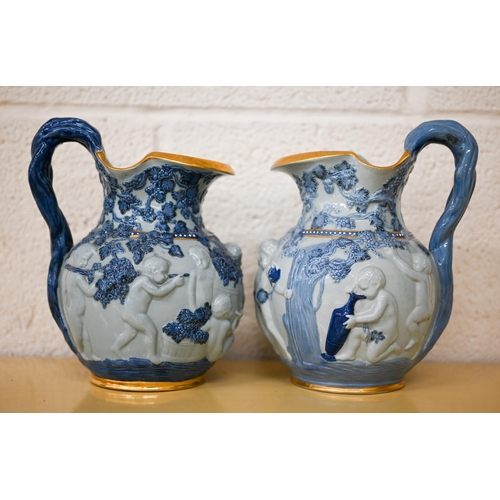 457 - Two Copeland 'Spode's Florentine' jugs, embossed with Bacchanalian putti, 20 cm high