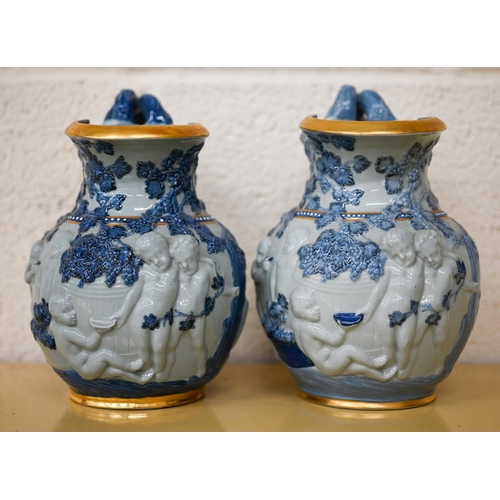 457 - Two Copeland 'Spode's Florentine' jugs, embossed with Bacchanalian putti, 20 cm high