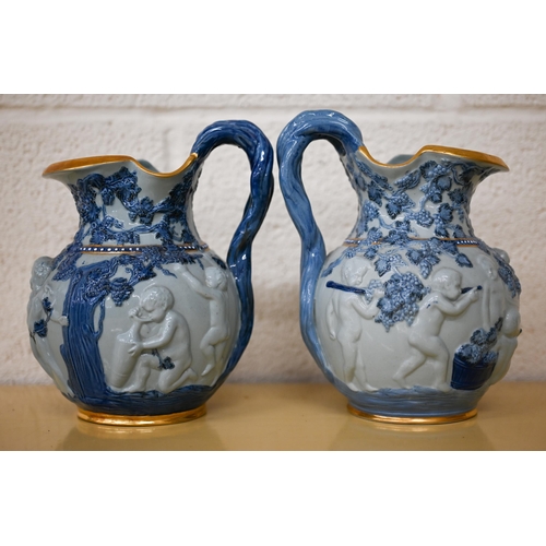 457 - Two Copeland 'Spode's Florentine' jugs, embossed with Bacchanalian putti, 20 cm high