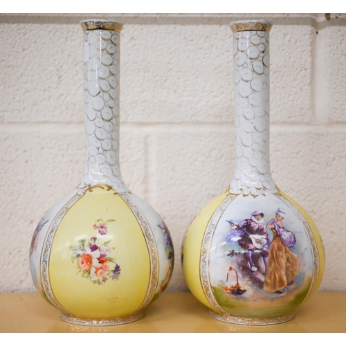 464 - A pair of Victoria (Carlsbad, Austria) ceramic bottle vases in the Dresden manner printed with fete ... 