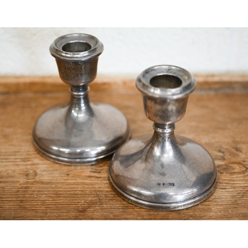 470 - A pair of loaded silver short candlesticks, Birmingham 1966, 9 cm high