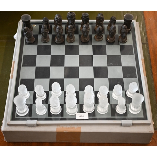 486 - A set of Czechoslovakian frosted glass chessmen in case c/w chessboardCase a/f