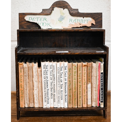 539 - A selection of vintage Beatrix Potter books (a/f), in oak bookcase