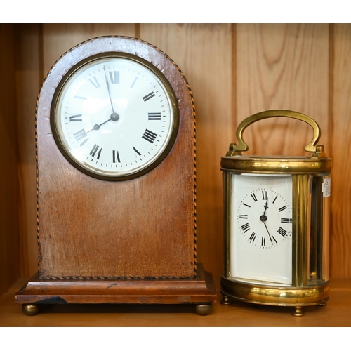 540 - An oval brass carriage clock 16 cm high overall to/w an inlaid mahogany mantel clock with French mov... 