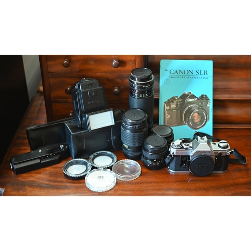 548 - A Canon AE-1 35mm camera no 3377408 to/w Canon zoom lens FD 100-200mm 1:5.6  and FD 35-105mm 1:3.5-4... 