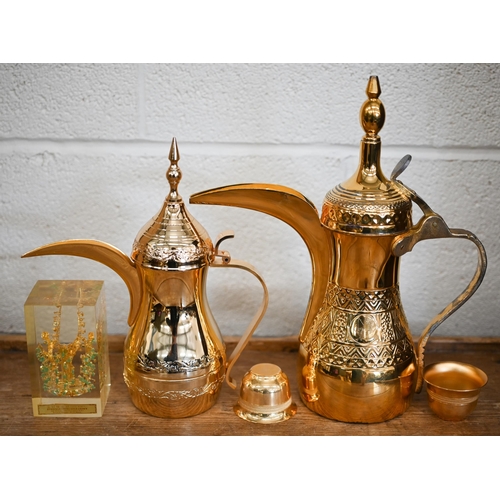 554 - An Italian cased gilt metal Omani coffee pot on tray with six cups to/w another coffee pot and a Kor... 