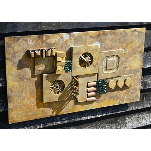 558 - #A 1970s abstract design relief panel, copper laid to wood, 50 x 92 cm