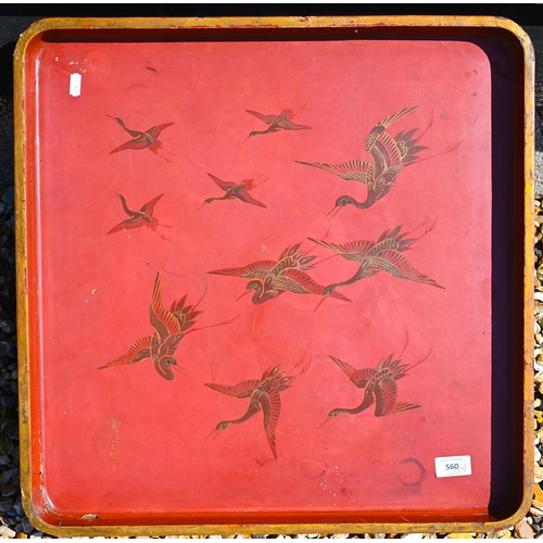 560 - An antique Japanese red lacquer and gilt papier mache tray, painted with cranes, signed, 54 cm squar... 