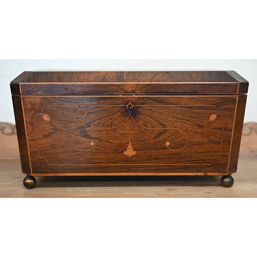 563 - A large 19th century inlaid rosewood sarcophagus tea caddy with two bone-handled covered inner compa... 