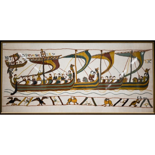 568 - Two large framed hand-embroidered sections after the Bayeux tapestry, 53 x 116 cm