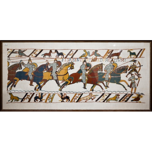 568 - Two large framed hand-embroidered sections after the Bayeux tapestry, 53 x 116 cm