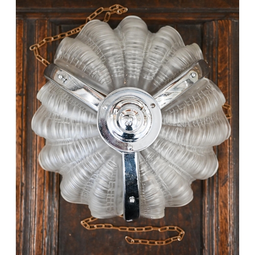 578 - An Art Deco chrome and glass ceiling lightshade with frosted shell segments, to/w two other shell se... 