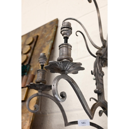 581 - A large scrolling metal three-sconce wall light, 65 cm high