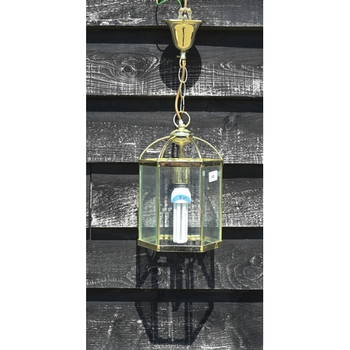 585 - #A hexagonal glass and brass ceiling light, 53 cm including chain