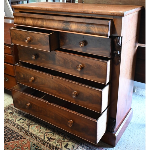 586 - A large Victorian country house chest of drawers, the full width cavetto drawer over two short and t... 