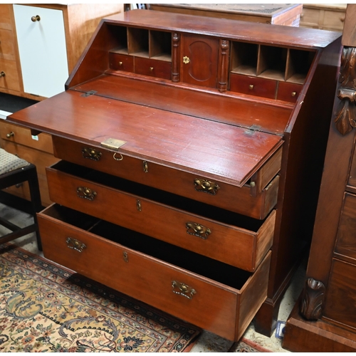 587 - A George III mahogany bureau with four long graduated drawers, raised on shaped bracket feet, 94 cm ... 