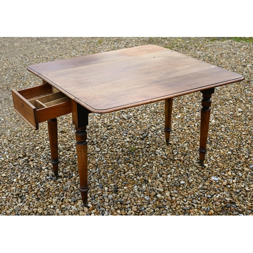 590 - A Victorian mahogany drop leaf Pembroke table, drawer to one end and raised on turned legs on castor... 