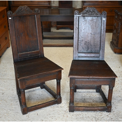 592 - A pair of late 17th/18th century North Country joint oak side chairs hall chairs t/with another pair... 