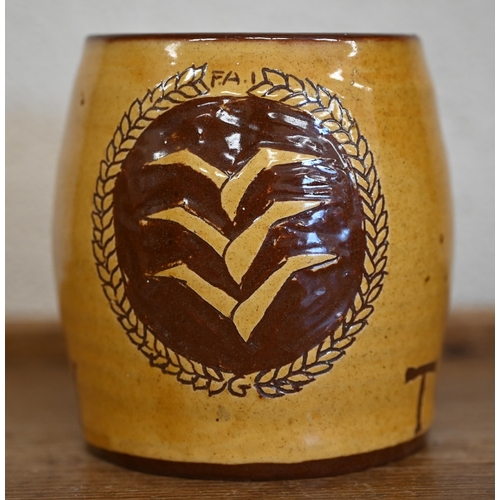 614 - #A slip-glazed earthenware mug decorated with Luftwaffe pilot's badge and inscribed 'Tony' 11 cm hig... 