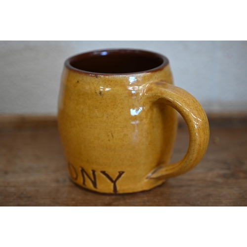 614 - #A slip-glazed earthenware mug decorated with Luftwaffe pilot's badge and inscribed 'Tony' 11 cm hig... 