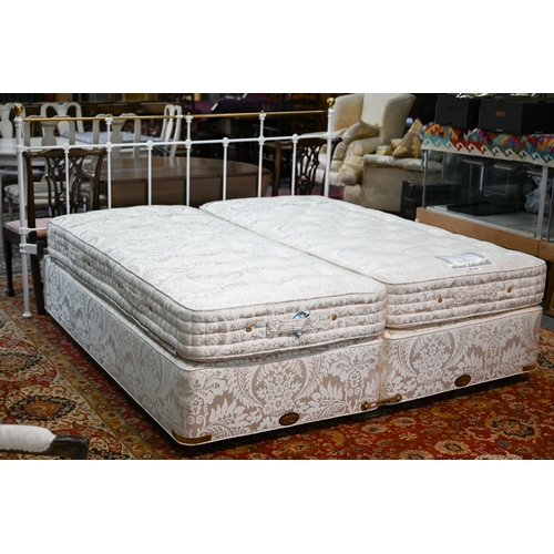 630 - A pair of Vi-Sprung Regal Supreme single bed base and mattresses, combined to form a super-king size... 