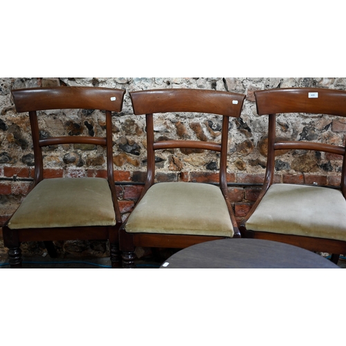 633 - A set of six Victorian mahogany bar back dining chairs, with fabric seat pads, raised on turned fron... 