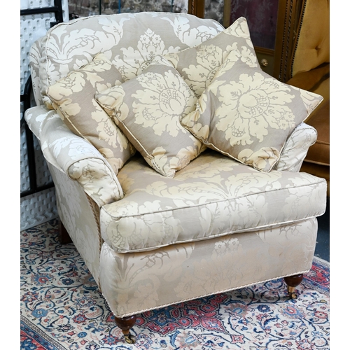 640 - #A contemporary cream/gold floral upholstered wing armchair by Duresta to/with an easy armchair in s... 