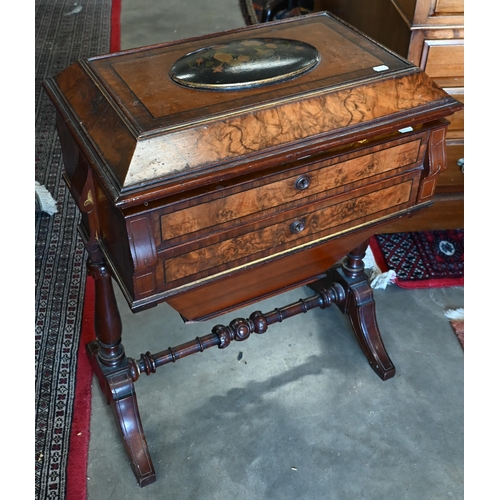 643 - A Victorian walnut sewing table with hinged top enclosing maple fitted interior with turned supports... 