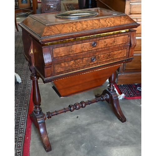 643 - A Victorian walnut sewing table with hinged top enclosing maple fitted interior with turned supports... 