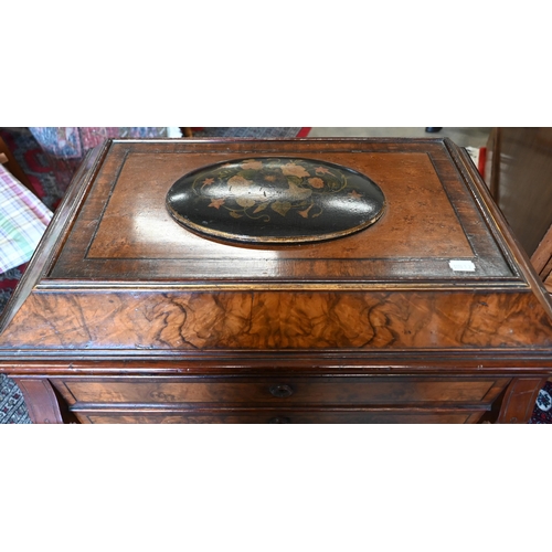 643 - A Victorian walnut sewing table with hinged top enclosing maple fitted interior with turned supports... 