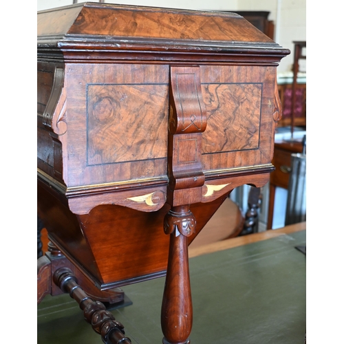 643 - A Victorian walnut sewing table with hinged top enclosing maple fitted interior with turned supports... 