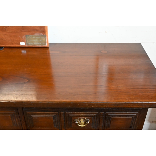 653 - A 'Younger' Toledo oak Spanish style sideboard with three frieze drawers above panelled doors, 157cm... 