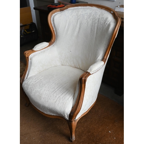 656 - A French beech-framed fauteuil armchair, upholstered and covered in cream brocade, on cabriole suppo... 