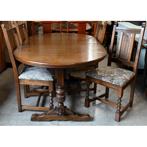 660 - A 'Wood Brothers' Old Charm extending dining table with leaf, on turned pillars tied with a stretche... 