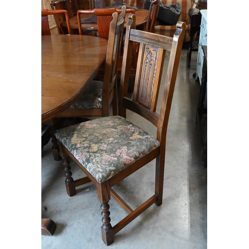 660 - A 'Wood Brothers' Old Charm extending dining table with leaf, on turned pillars tied with a stretche... 