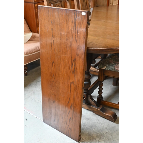 660 - A 'Wood Brothers' Old Charm extending dining table with leaf, on turned pillars tied with a stretche... 