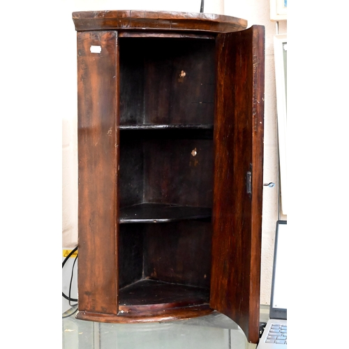 668 - A small antique barrel front hanging corner cupboard, 65 cm h