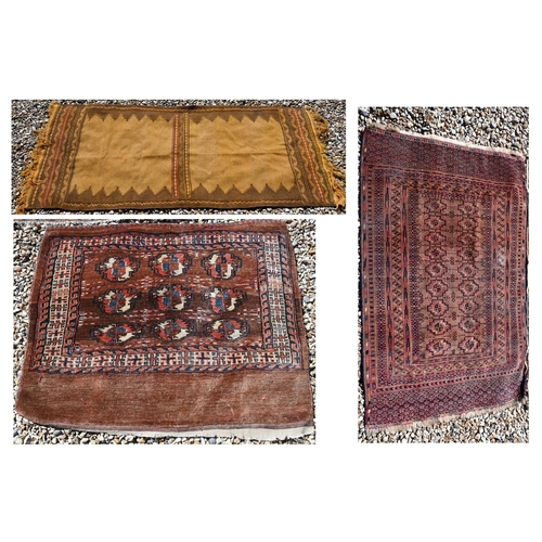 673 - An small antique Turkoman rug, 122 cm x 78 cm to/w a Turkoman bag face, 97 cm x 84 cm and a camel gr... 