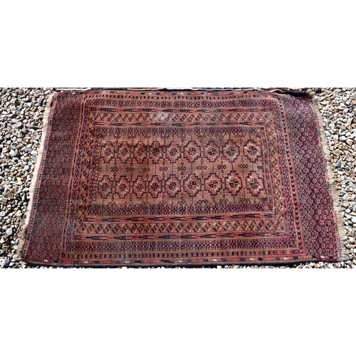 673 - An small antique Turkoman rug, 122 cm x 78 cm to/w a Turkoman bag face, 97 cm x 84 cm and a camel gr... 