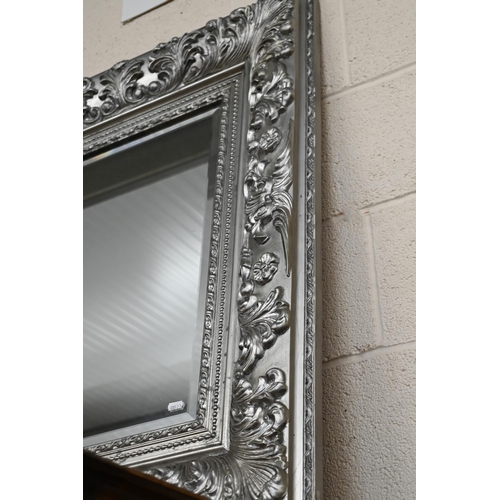 677 - A large Victorian style silver framed bevel edged mirror, 122 cm x 92 cm