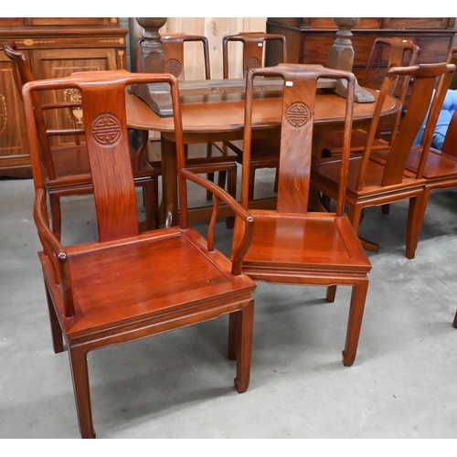 680 - A set of eight Chinese rosewood dining chairs, the backs carved with Shou symbols and panelled seats... 