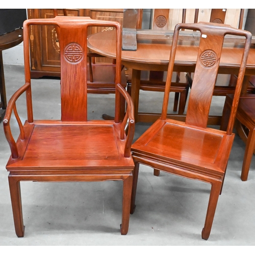 680 - A set of eight Chinese rosewood dining chairs, the backs carved with Shou symbols and panelled seats... 