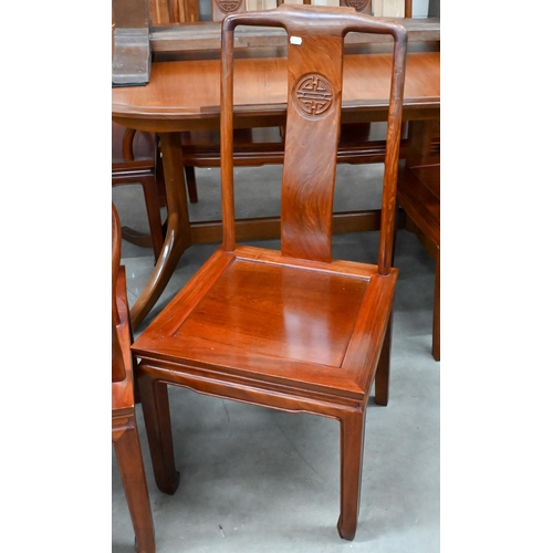 680 - A set of eight Chinese rosewood dining chairs, the backs carved with Shou symbols and panelled seats... 