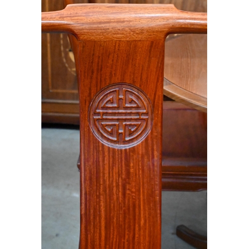 680 - A set of eight Chinese rosewood dining chairs, the backs carved with Shou symbols and panelled seats... 